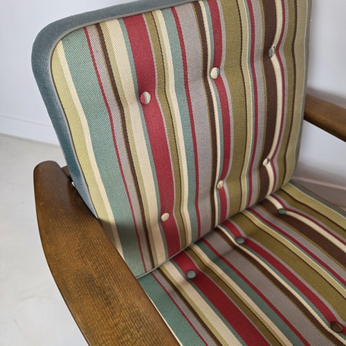 Close-up of Mid‑century GE233 armchair by Hans J. Wegner with original upholstery and classic Danish design