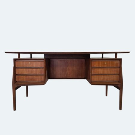1960s Peter Løvig Nielsen teak desk with six drawers, recessed centre compartment and tapered legs, Danish mid‑century modern design