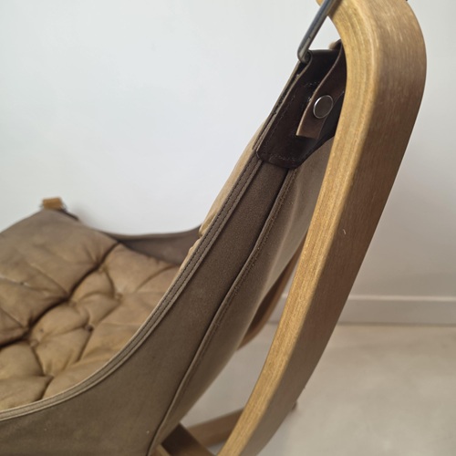 Detail of beech frame and suspended canvas construction on the Falcon chair by Sigurd Ressel
